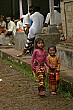 Photo of two Balinese girls breaking into a smile when they see the camera courtesy of Jen & Winston Yeung